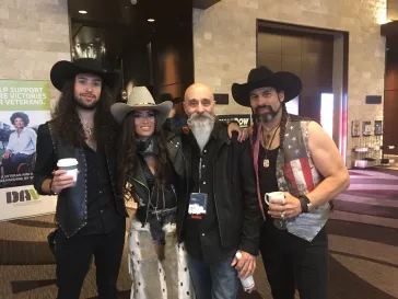 Band members and fans at a country music event